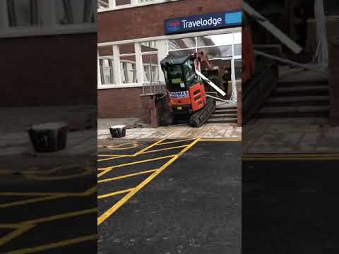 A Construction Worker Who Didn’t Get Paid Drives an Excavator into the Building He Was Working On