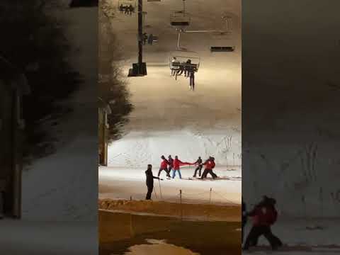 A Skier Dangles From a Chair Lift, and Then Drops Into a Safety Net