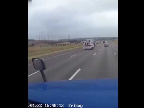 An Ambulance Falls Off a Trailer and Rolls Across a Busy Highway Untouched